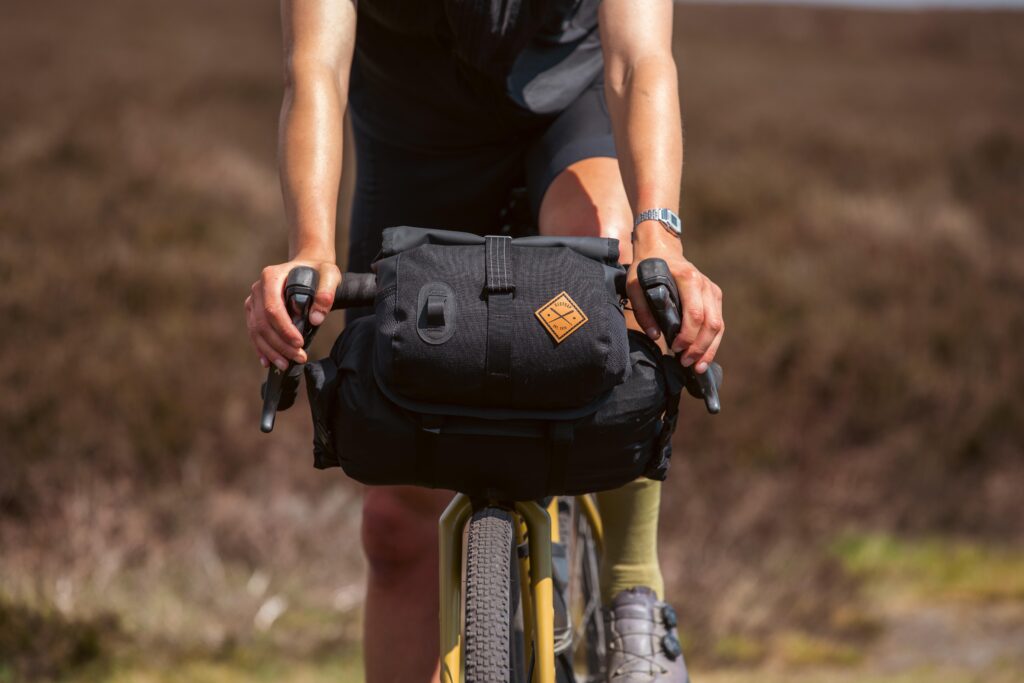 Restrap Launches Sleek New Flat Bar and Rolltop Canister Bags Alongside Upgraded Race and Bikepacking Bar Packs